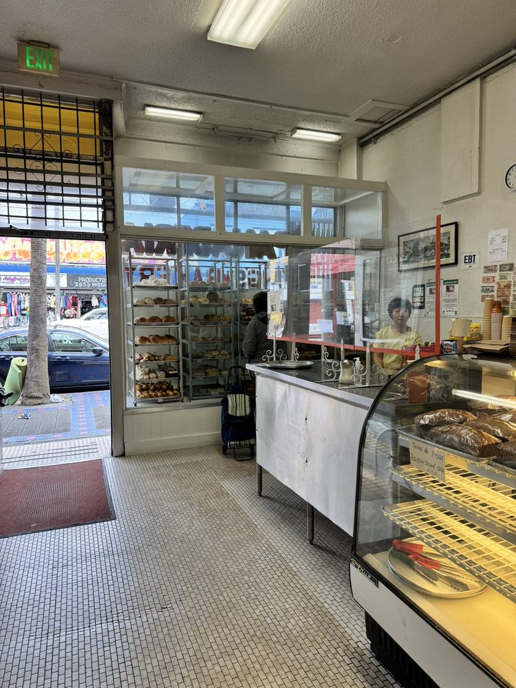 The counter, pastry displays, and Mission Street entrance at Kings Bakery Cafe
